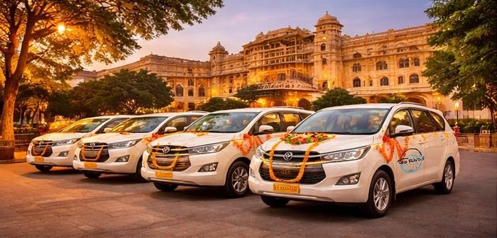 Four decorated Ruia Travels wedding cars parked outside a Jaipur heritage hotel at dusk